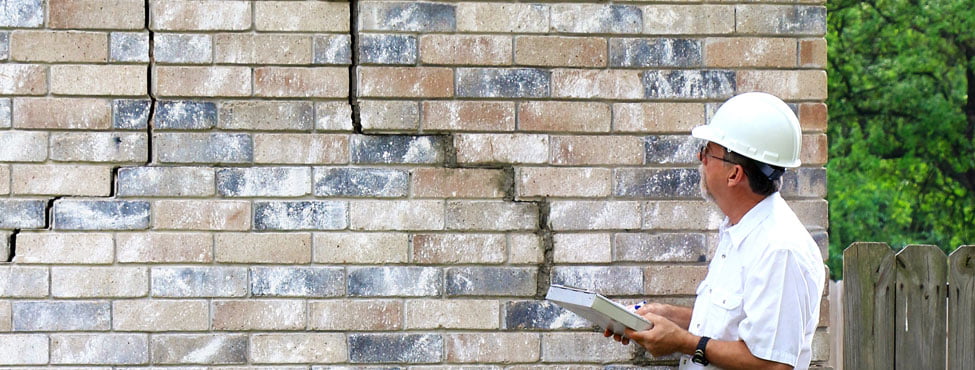 cracked exterior brick wall