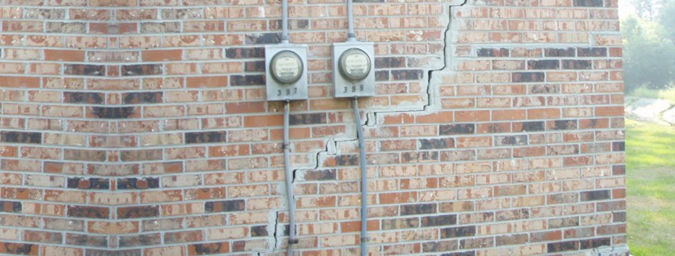 cracked exterior brick wall