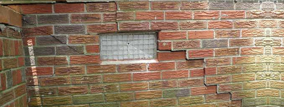 cracked exterior brick wall