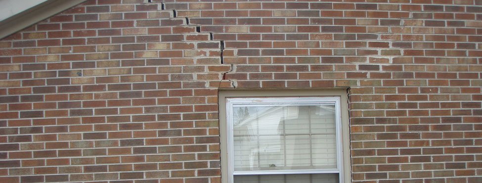cracked exterior brick wall