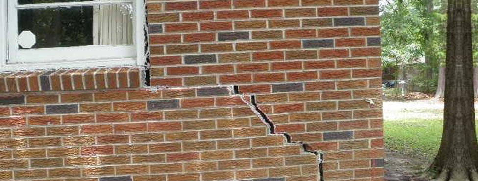 cracked exterior brick wall