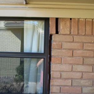 Gap in window molding on exterior of house; foundation issue